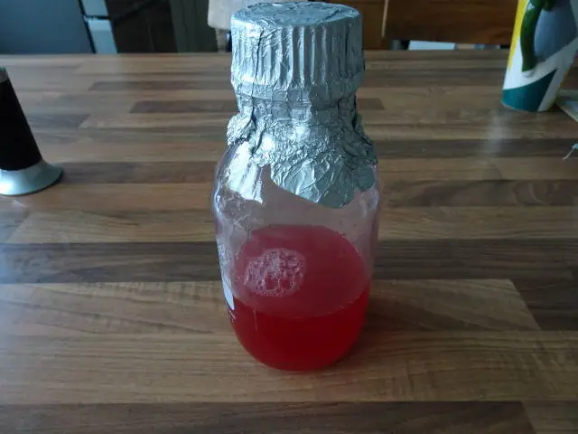 Red agar in a bottle