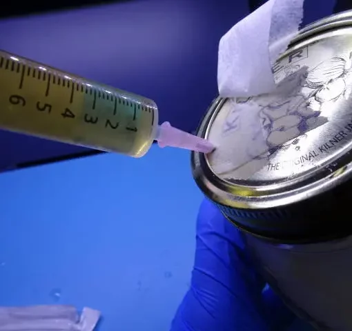 Injecting a liquid culture jar for mushrooms